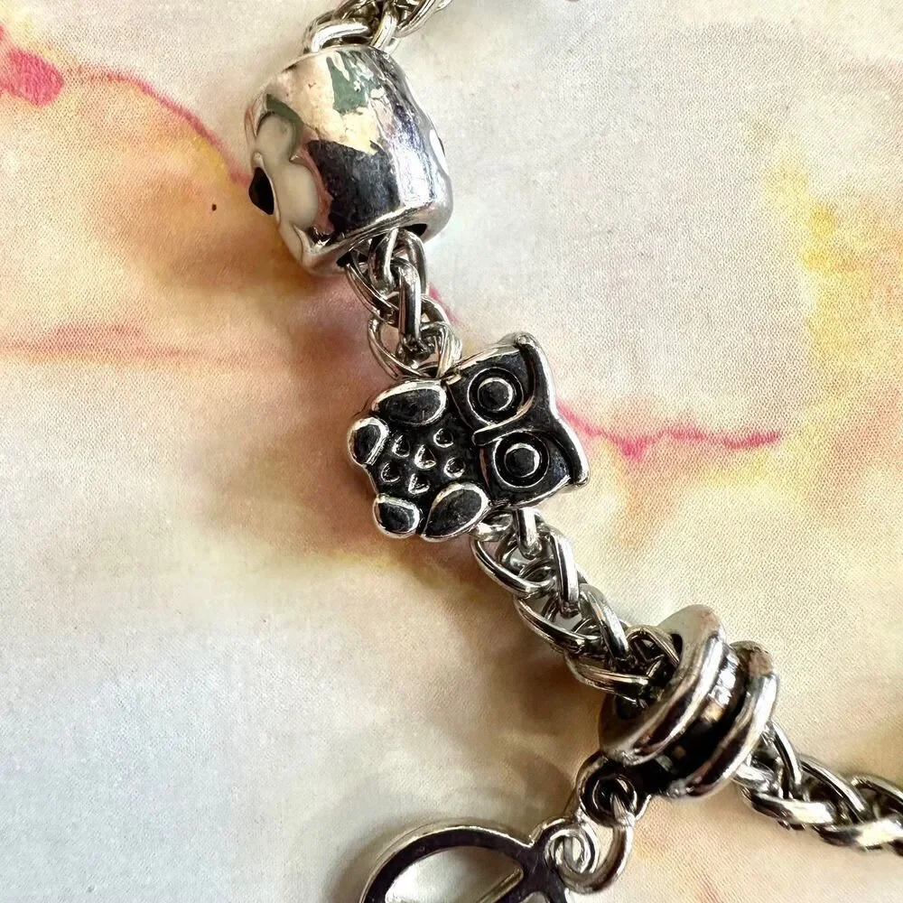 Silver tone bird flower peace owl charm bracelet